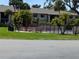 Community BBQ area with picnic tables and umbrellas at 1515 Forrest Nelson Blvd # E106, Port Charlotte, FL 33952
