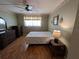 Spacious bedroom with laminate flooring and ceiling fan at 1515 Forrest Nelson Blvd # E106, Port Charlotte, FL 33952