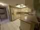 Bright kitchen features updated countertops and appliances at 1515 Forrest Nelson Blvd # E106, Port Charlotte, FL 33952