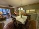 Cozy dining room with wood table and access to the kitchen at 1515 Forrest Nelson Blvd # E106, Port Charlotte, FL 33952
