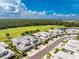 Aerial view of two-story townhouses with golf course views at 14648 Sycamore Ct # 3022, Punta Gorda, FL 33955