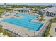 Resort-style pool with lap lanes, a large leisure pool, and a poolside bar at 14121 Heritage Landing Blvd # 731, Punta Gorda, FL 33955