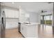 Modern kitchen with white cabinets and island at 14121 Heritage Landing Blvd # 731, Punta Gorda, FL 33955