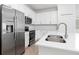 Stainless steel appliances and white cabinetry at 14121 Heritage Landing Blvd # 731, Punta Gorda, FL 33955