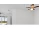 Bright living room with high ceilings, ceiling fan, and access to a balcony at 14121 Heritage Landing Blvd # 731, Punta Gorda, FL 33955