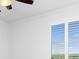 Bedroom with plantation shutters and view of the landscape at 14121 Heritage Landing Blvd # 731, Punta Gorda, FL 33955