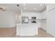 Open concept kitchen with white cabinets and stainless steel appliances at 14121 Heritage Landing Blvd # 731, Punta Gorda, FL 33955