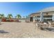Relaxing poolside patio with tables and umbrellas at 14121 Heritage Landing Blvd # 731, Punta Gorda, FL 33955