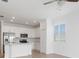 Modern kitchen with white cabinets, stainless steel appliances and island at 14121 Heritage Landing Blvd # 731, Punta Gorda, FL 33955