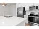 Modern kitchen with stainless steel appliances and white cabinets at 14121 Heritage Landing Blvd # 731, Punta Gorda, FL 33955