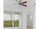 Bright bedroom with sliding glass doors leading to a balcony with a view at 14121 Heritage Landing Blvd # 731, Punta Gorda, FL 33955