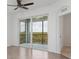 Spacious bedroom with balcony access and a view of the surrounding landscape at 14121 Heritage Landing Blvd # 731, Punta Gorda, FL 33955