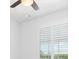 Bedroom with ceiling fan and window with plantation shutters at 14121 Heritage Landing Blvd # 731, Punta Gorda, FL 33955