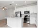 Bright kitchen featuring stainless steel appliances and an island at 14121 Heritage Landing Blvd # 731, Punta Gorda, FL 33955