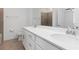 Double vanity bathroom with tile shower and floor at 14121 Heritage Landing Blvd # 731, Punta Gorda, FL 33955