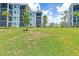 Expansive lawn area with building views at 14121 Heritage Landing Blvd # 731, Punta Gorda, FL 33955