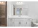 Bathroom with white cabinets, quartz countertop, and a large mirror at 14121 Heritage Landing Blvd # 731, Punta Gorda, FL 33955