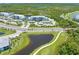 Condo building near a golf course and pond, providing convenient access and scenic views at 14121 Heritage Landing Blvd # 731, Punta Gorda, FL 33955