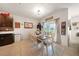 Charming dining room with a farmhouse table and view of the backyard at 27441 Natal Dr, Punta Gorda, FL 33983