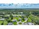 Community overview showcasing various houses and lush greenery at 27441 Natal Dr, Punta Gorda, FL 33983