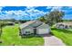 Aerial view of a single-Gathering home with a paved driveway at 27441 Natal Dr, Punta Gorda, FL 33983