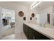 Double vanity bathroom with a view into a bedroom at 27441 Natal Dr, Punta Gorda, FL 33983