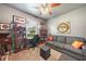 Home office features a desk, couch, and shelving at 27441 Natal Dr, Punta Gorda, FL 33983