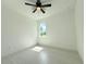 Bright bedroom with tile flooring and a ceiling fan at 26345 Trinilas Dr, Punta Gorda, FL 33983