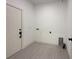 Laundry room with hook ups and tile flooring at 26345 Trinilas Dr, Punta Gorda, FL 33983
