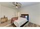 Bright bedroom featuring wood-look floors and a ceiling fan at 1241 Macaw Ct, Punta Gorda, FL 33950