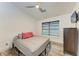 Cozy bedroom with a ceiling fan and wood-look floors at 1241 Macaw Ct, Punta Gorda, FL 33950