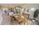 Dining area with a rustic wood table and modern chairs at 28976 Gin Ln, Punta Gorda, FL 33982
