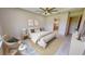 Bright bedroom with plush bed and sitting area at 28976 Gin Ln, Punta Gorda, FL 33982