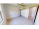 Well-lit bedroom with wood-look floors and a spacious closet at 28976 Gin Ln, Punta Gorda, FL 33982
