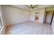 Spacious bedroom with wood-look floors and ceiling fan at 28976 Gin Ln, Punta Gorda, FL 33982