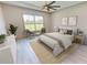 Main bedroom with a king-size bed and seating area at 28976 Gin Ln, Punta Gorda, FL 33982