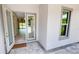 Double door entry with sidelights, opening to interior living space at 28976 Gin Ln, Punta Gorda, FL 33982