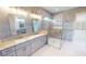 Elegant bathroom with double vanity and large shower at 28976 Gin Ln, Punta Gorda, FL 33982