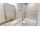 Modern bathroom with granite countertop, a soaking tub, and updated fixtures at 28976 Gin Ln, Punta Gorda, FL 33982