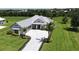 Single-Gathering home with metal roof and paved driveway at 28976 Gin Ln, Punta Gorda, FL 33982