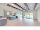 Open kitchen with island, stainless steel appliances, and wood beams at 28976 Gin Ln, Punta Gorda, FL 33982