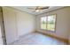 Bright bedroom with large window and ceiling fan at 28976 Gin Ln, Punta Gorda, FL 33982