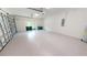 Spacious garage with epoxy flooring and ample storage space at 28976 Gin Ln, Punta Gorda, FL 33982