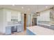Bright kitchen featuring white and gray cabinets at 28976 Gin Ln, Punta Gorda, FL 33982