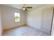 Light and airy bedroom featuring wood-look floors and a ceiling fan at 28976 Gin Ln, Punta Gorda, FL 33982