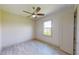 Simple bedroom with wood-look floors and ceiling fan at 28976 Gin Ln, Punta Gorda, FL 33982