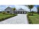 Stunning curb appeal with landscaping and a paved driveway at 28976 Gin Ln, Punta Gorda, FL 33982