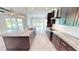 Spacious kitchen featuring a large island, granite countertops, and stainless steel appliances at 28992 Gin Ln, Punta Gorda, FL 33982