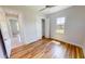 Spacious bedroom with wood floors, ceiling fan, and a large closet at 28992 Gin Ln, Punta Gorda, FL 33982