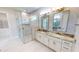 Elegant bathroom with double vanity, granite countertop, and large walk-in shower at 28992 Gin Ln, Punta Gorda, FL 33982